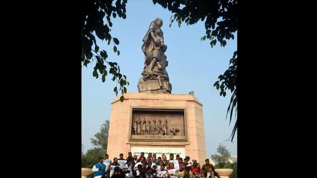 Communist Party of India (CPI) leader Kanhaiya Kumar along with opposition party leaders holding up posters for a rally against Citizenship Amendment Act (CAA) and the proposed National Register of Citizens (NRC), near Mahatma Gandhi statue at Gandhi Maidan in Patna, Bihar. (Parwaz Khan / HT Photo)