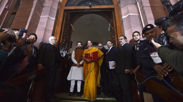 Minister of Finance Nirmala Sitharaman seen holding the Budget folder (bahi khaata) along with Minister of State Anurag Thakur and other senior officials as they arrive at Parliament to present the Union Budget 2020-21 in New Delhi. (Sonu Mehta / HT Photo)