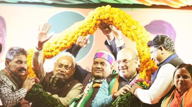 Home Minister Amit Shah with Bihar Chief Minister Nitish Kumar during a rally in Burari in New Delhi on Sunday. (Arvind Yadav/HT Photo) Home Minister Amit Shah with Bihar Chief Minister Nitish Kumar during a rally in Burari in New Delhi on Sunday. (Arvind Yadav/HT Photo)