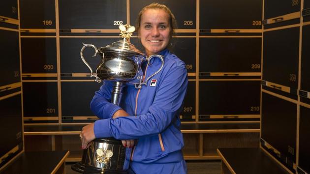 Sofia Kenin poses for a photo in the locker room with the Daphne Ackhurst Memorial Cup.(AP)