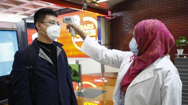 A passenger from Beijing is screened as part of measures to prevent coronavirus infection at Hazrat Shahjalal International airport in Dhaka, Bangladesh. (AP) A passenger from Beijing is screened as part of measures to prevent coronavirus infection at Hazrat Shahjalal International airport in Dhaka, Bangladesh. (AP)