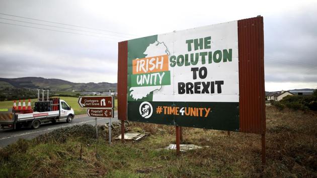 Motorists pass an anti-Brexit poster close to the Irish border, beside the town of Newry, Northern Ireland. While Britain formally left the EU at 11pm local time Friday, the hard work of building a new economic relationship between the bloc and its ex-member has just begun. (Peter Morrison / AP) Motorists pass an anti-Brexit poster close to the Irish border, beside the town of Newry, Northern Ireland. While Britain formally left the EU at 11pm local time Friday, the hard work of building a new economic relationship between the bloc and its ex-member has just begun. (Peter Morrison / AP)
