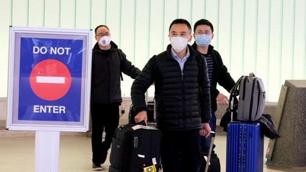 Passengers arrive at LAX from Shanghai, China, after a positive case of the coronavirus was announced in the Orange County suburb of Los Angeles, California. (REUTERS) Passengers arrive at LAX from Shanghai, China, after a positive case of the coronavirus was announced in the Orange County suburb of Los Angeles, California. (REUTERS)