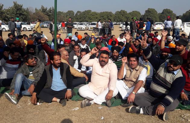 Cab drivers working with app-based aggregators protesting at Dussehra Ground in Phase 8, Mohali, on Monday.(Gurminder Singh/HT)