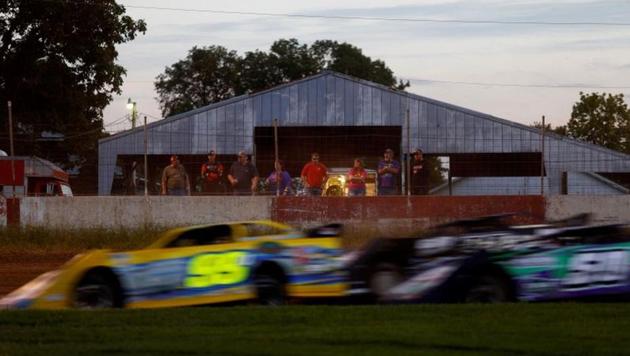 People watch race cars drive past at the West Liberty Race Track, in West Liberty, Iowa, United States. Latinos in Iowa, overlooked as a political force for years in the state that kicks off the U.S. presidential race, have been getting unprecedented attention in a too-close-to-call Democratic White House nominating fight. (Eric Thayer / REUTERS)