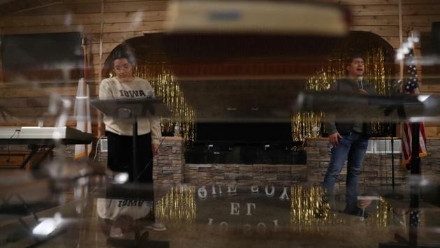 Silvia Rojas and Samuel Contreras take part in a rehearsal at the Independent Pentecostal Christian Church in West Liberty. The growth in Iowa’s Hispanic population, a community largely of Mexican heritage, so far has not been matched by progress in its political power. Language barriers have hindered participation, particularly in the sometimes confusing caucuses. (Eric Thayer / REUTERS)