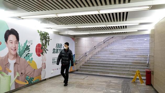 A pedestrian wearing a protective mask walks through a tunnel in Beijing, China, on Sunday, Feb. 2, 2020.(Bloomberg) A pedestrian wearing a protective mask walks through a tunnel in Beijing, China, on Sunday, Feb. 2, 2020.(Bloomberg)