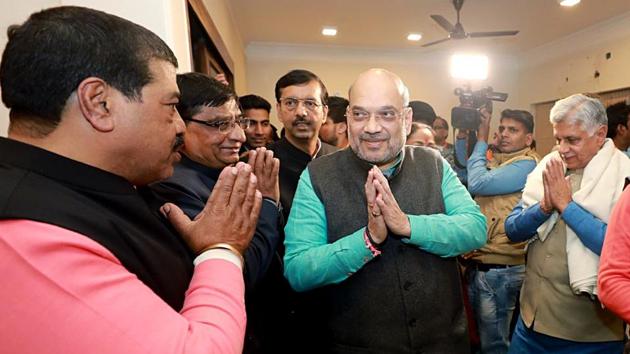 Union Home Minister Amit Shah greets BJP workers during the party meeting ahead of the Delhi assembly elections, at Shalimar Bagh, in New Delhi. (ANI Photo) Union Home Minister Amit Shah greets BJP workers during the party meeting ahead of the Delhi assembly elections, at Shalimar Bagh, in New Delhi. (ANI Photo)