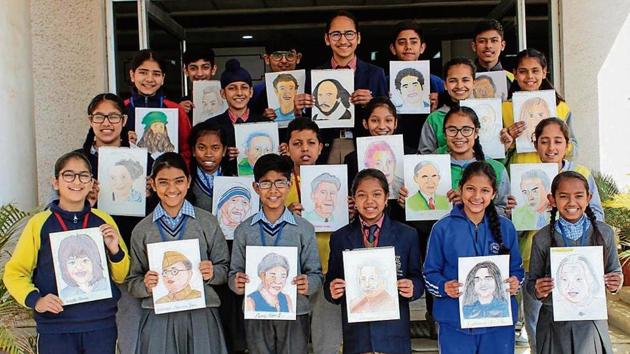 Children with their artwork. (HT) Children with their artwork. (HT)