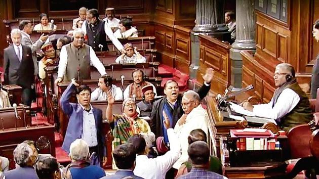Opposition MPs protest in the Rajya Sabha on Monday.(ANI)