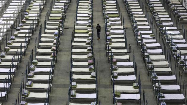 A worker walks among beds in a convention center that has been converted into a temporary hospital. With more countries imposing restrictions on travelers from China, and reports of discrimination against Chinese abroad, the country’s diplomats are speaking out. Chinese ambassador in Sri Lanka Cheng Xueyuan expressed worries over Chinese people being turned away by restaurants and taxis in the Indian Ocean island nation. (AP)