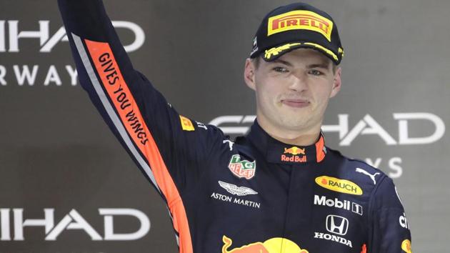 Red Bull driver Max Verstappen of the Netherland's holds the trophy.(AP)