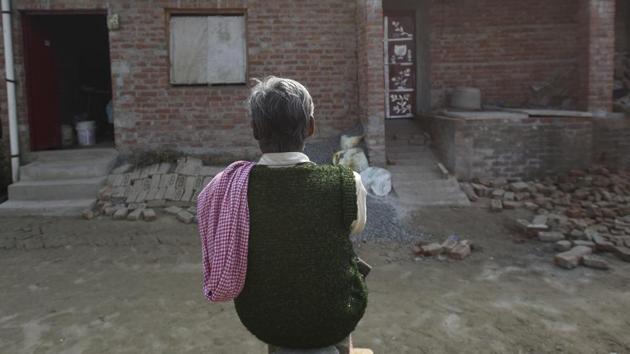 Villagers gather outside the house of Subhash Batham, who had taken 25 children hostage and was later killed in police operation, at Karthia village, in Farrukhabad. Despite the house stacked with 150 crude bombs, and Batham wielding a rifle and a pistol, all 25 children escaped unscathed, thanks largely to the presence of mind of two teenagers who managed to stall Batham, snap the bomb-connecting wires, and lock the hostage-taker out of the bunker. (Burhaan Kinu / HT Photo)