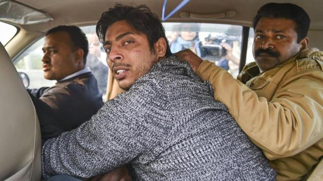 Police take away Kapil Gujjarn after he allegedly opened fire in the Shaheen Bagh area of New Delhi, Saturday, Feb. 1, 2020. (PTI file photo) Police take away Kapil Gujjarn after he allegedly opened fire in the Shaheen Bagh area of New Delhi, Saturday, Feb. 1, 2020. (PTI file photo)
