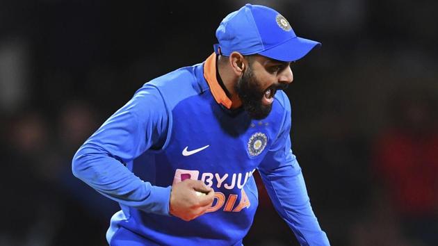 India's Virat Kohli runs out New Zealand's Colin de Grandhomme.(AP) India's Virat Kohli runs out New Zealand's Colin de Grandhomme.(AP)