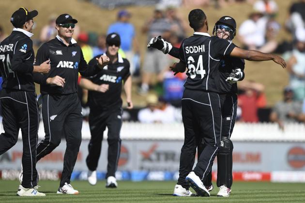New Zealand's Ish Sodhi is congratulated by Tom Latham after dismissing Virat Kohli during the One Day cricket international between India and New Zealand at Seddon Oval in Hamilton (AP)