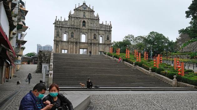 People wear masks as they walk in front of the Ruins of St. Paul’s, following the coronavirus outbreak in Macau. The Chinese territory of Macau has become a near-ghost town during what is typically the busiest time of year in the world’s biggest casino hub, after authorities announced a raft of measures to keep visitors away and contain the new coronavirus. (Tyrone Siu / REUTERS)