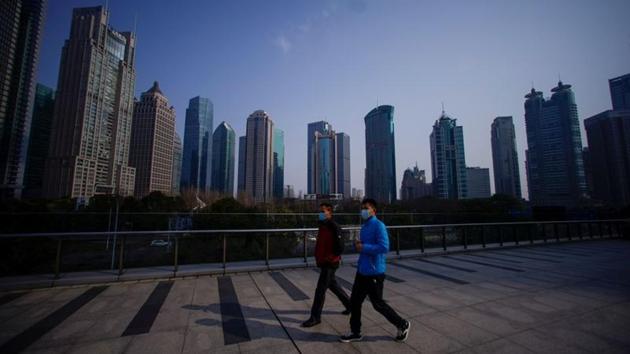 People wearing masks are seen at Lujiazui financial district in Pudong. Reduced travel from China alone could result in 50 billion baht ($1.52 billion) of lost tourism revenue, the Thai Tourism Ministry estimated. The spread of coronavirus beyond China has also affected domestic tourism in Thailand, which has recorded more infections than anywhere but China with 19 cases. (Aly Song / REUTERS)