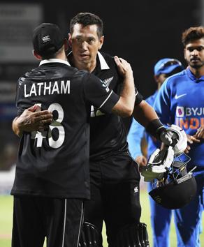 Ross Taylor hugs his captain Tom Latham at the end of the One Day cricket international between India and New Zealand at Seddon Oval in Hamilton (AP)
