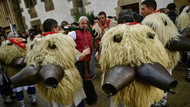 The annual procession stems from ceremonies held to ward off evil spirits and bless the harvests to come. The celebration, traditionally held at the end of January, is believed to date from before Roman times. (Alvaro Barrientos / AP)