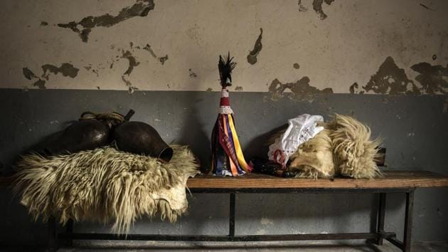 Sheepskins, a conical caps with ribbons and cowbells, elements used by "Joaldunak", are seen on a bench ahead of a Carnival in the small Pyrenees village of Zubieta, northern Spain. In one of the most ancient carnival celebrations in Europe, dozens of people don sheepskins, lace petticoats and conical caps and sling cowbells across their lower backs as they parade to herald the advent of spring. (Alvaro Barrientos / AP)