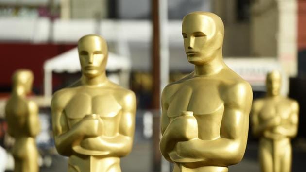 Oscar statues stand off of Hollywood Boulevard in preparation for Sunday's 92nd Academy Awards at the Dolby Theatre, Wednesday.(Chris Pizzello/Invision/AP)