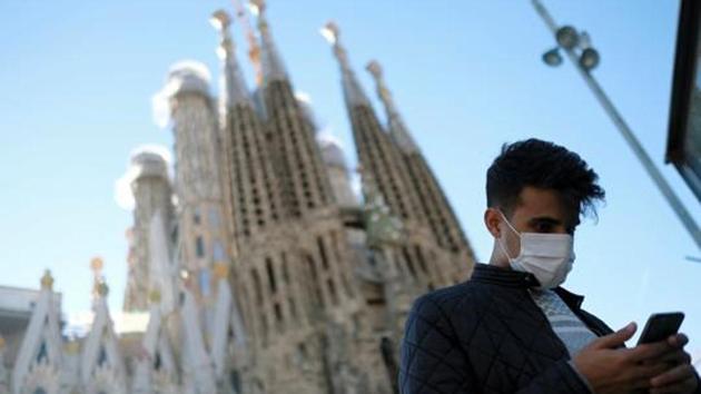 A man wears a protective mask in front of Basilica Sagrada Familia, amid the novel coronavirus outbreak, in Barcelona, Spain February 2, 2020. (Reuters File Photo) A man wears a protective mask in front of Basilica Sagrada Familia, amid the novel coronavirus outbreak, in Barcelona, Spain February 2, 2020. (Reuters File Photo)