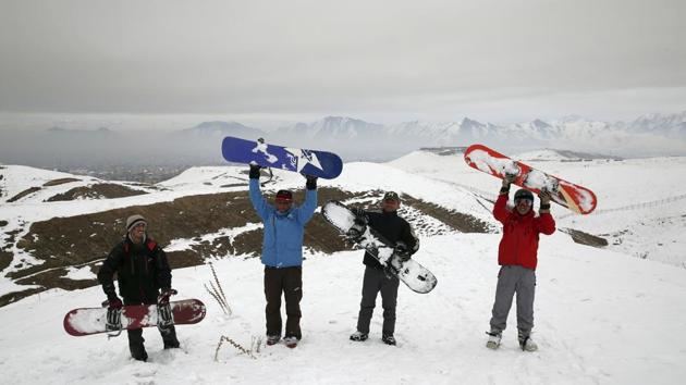Members of the Afghanistan Snowboarding Federation pose for a photograph during a practice session. Kabul is better known for its hulking concrete blast walls and tense security checkpoints. But it also sits in a valley in the Hindu Kush mountains at an elevation of around 1,800 metres (5,900 feet). The rugged terrain has inspired young Afghans to take to the surrounding mountains in search of fun. (Rahmat Gul / AP)