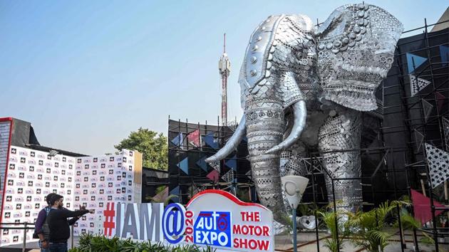 Visitors are seen at the entrance of the Auto Expo. The expo is organised jointly by ACMA, CII and SIAM from February 7-12 for the general public, at the India Expo Mart in Uttar Pradesh’s Greater Noida. (Money sharma / AFP)