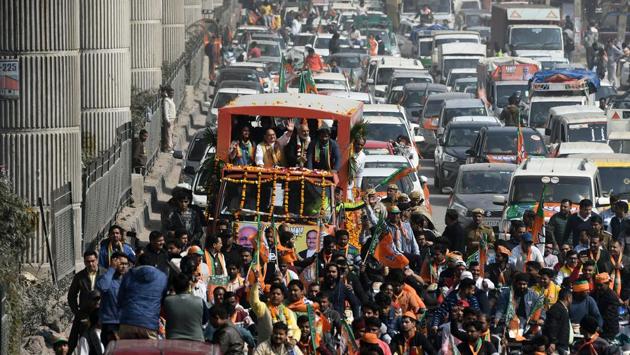 BJP National President Jagat Prakash Nadda along with Azad Singh during a roadshow for upcoming Delhi Assembly Elections at Mundka. The BJP’s campaign revolved around its decision to provide ownership papers to residents of unauthorised colonies, and a sharp attack on the AAP for what it alleged was support for the Shaheen Bagh protests against the Citizenship (Amendment) Act. (Biplov Bhuyan / HT Photo)