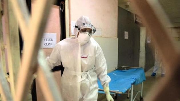 Health officials in full protective gear walk inside an isolation ward of Ernakulam Medical College in Kochi in Kerala on June 6, 2019. - MCVR carried out tests on the Nipah virus of which there was an outbreak in Kerala in 2018 and 2019, said one of the government officials cited above, asking not to be named.(AFP FILE) Health officials in full protective gear walk inside an isolation ward of Ernakulam Medical College in Kochi in Kerala on June 6, 2019. - MCVR carried out tests on the Nipah virus of which there was an outbreak in Kerala in 2018 and 2019, said one of the government officials cited above, asking not to be named.(AFP FILE)