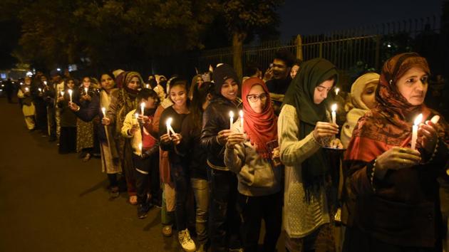 People holding candles march as part of an ongoing protest against the Citizenship Amendment Act (CAA) and National Register of Citizens (NRC), at Jamia Millia Islamia University in New Delhi on Friday. (Burhaan Kinu/HT PHOTO) People holding candles march as part of an ongoing protest against the Citizenship Amendment Act (CAA) and National Register of Citizens (NRC), at Jamia Millia Islamia University in New Delhi on Friday. (Burhaan Kinu/HT PHOTO)