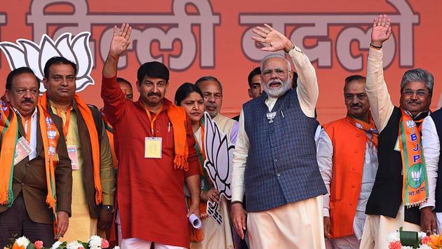 Prime Minister Narendra Modi with Delhi BJP chief Manoj Tiwari, Harsh Vardhan and others at an election campaign rally for the Delhi Assembly, at CBD Ground, in Karkardooma. While AAP sought votes in the name of Kejriwal as the CM face, the BJP did not put up a CM candidate and sought support in the name of Prime Minister Narendra Modi. (Raj K Raj / HT Photo)