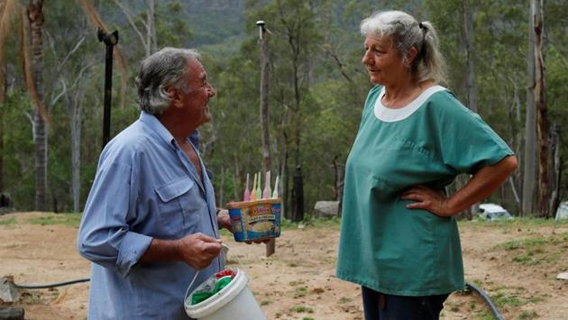 Wilson and Willis outside their home. More than a dozen of the marsupials snuggled into fabric pouches hung in the couple’s living room, like stockings on Christmas Eve. (Jorge Silva / REUTERS)
