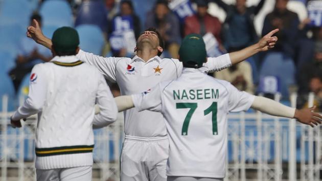 Pakistan pacer Shaheen Shah Afridi, center, celebrates with teammates.(AP)