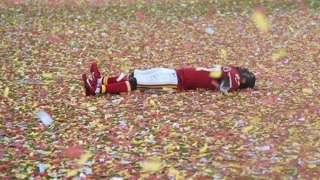 Cornerback for the Kansas City Chiefs Rashad Fenton lies on the pitch as he celebrates after winning Super Bowl LIV against the San Francisco 49ers at Hard Rock Stadium in Miami Gardens, Florida. (Timothy A Clary / AFP)