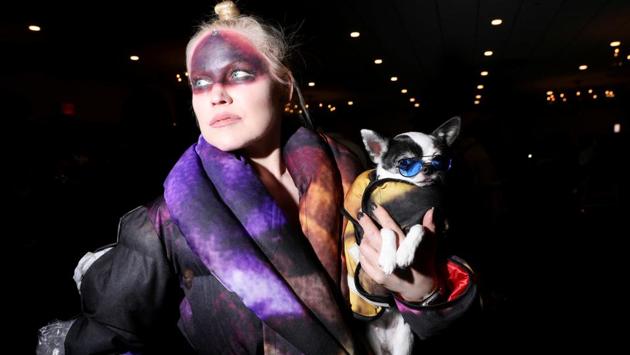 A woman holds a chihuahua named April Moon at the 17th annual New York Pet Fashion Show in the Manhattan borough of New York, U.S., February 6, 2020. REUTERS/Caitlin Ochs TPX IMAGES OF THE DAY (REUTERS)