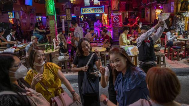 Tourists at Khao San road, a well-liked spot among foreign tourist in Bangkok. Some observers, like Prof. Lisa Wan of the School of Hotel and Tourism Management at the Chinese University of Hong Kong Business School, are fairly confident the tourism industry will bounce back soon. (Gemunu Amarasinghe / AP)