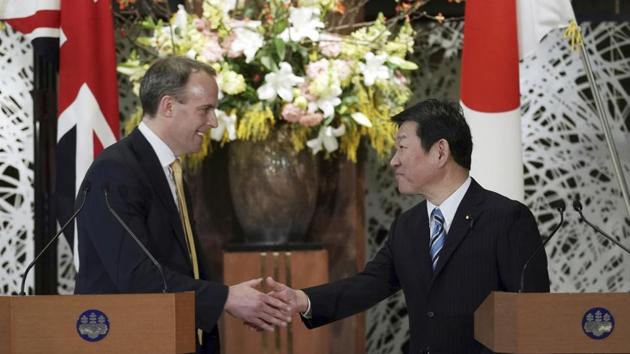 Britain's Foreign Secretary Dominic Raab, left, and Japan's Foreign Minister Toshimitsu Motegi shake hands after their remarks in Tokyo. (AP) Britain's Foreign Secretary Dominic Raab, left, and Japan's Foreign Minister Toshimitsu Motegi shake hands after their remarks in Tokyo. (AP)