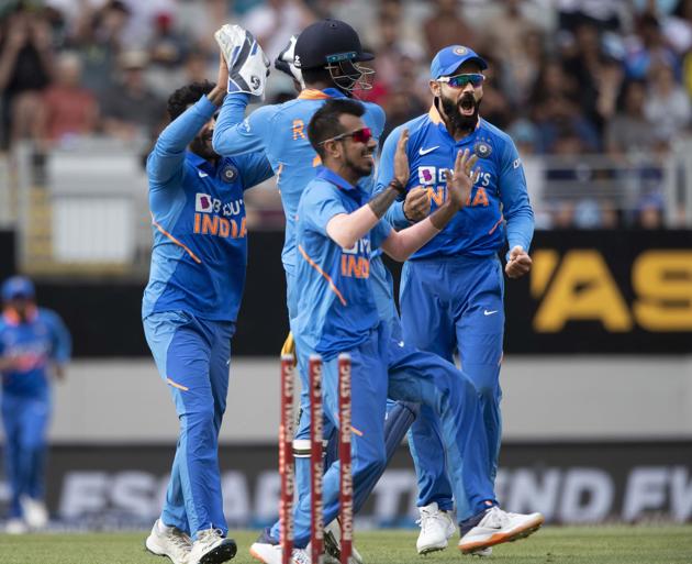 India's team celebrates running out Black Caps opener Martin Guptill for 79 during a One Day International cricket between India and New Zealand at Eden Park in Auckland (AP)
