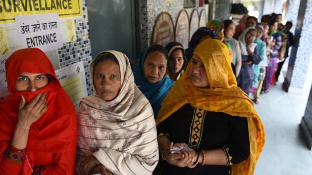 Women voters queue up at Mitraon village at Najafgarh. Delhi Chief Minister Arvind Kejriwal urged women to vote in the Delhi Assembly polls on Saturday, saying like their home, the nation is also their responsibility. (Vipin Kumar / HT Photo)