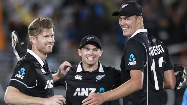 Black Caps, from left, James Neesham, Tom Latham and Kyle Jamieson celebrate their win over India.(AP)