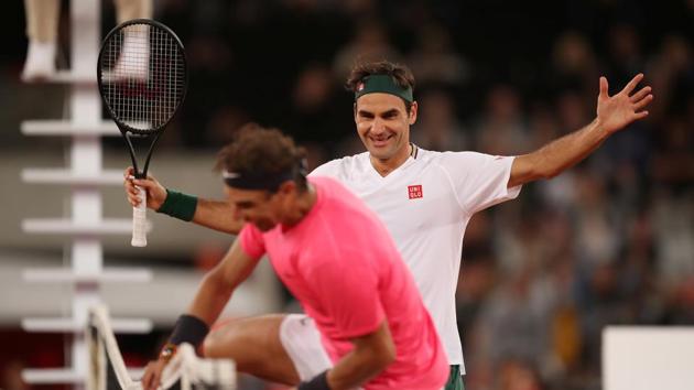 Tennis - "The Match In Africa" Exhibition Match - Cape Town Stadium, Cape Town, South Africa - February 7, 2020 Switzerland's Roger Federer with Spain's Rafael Nadal after winning their exhibition match(REUTERS)