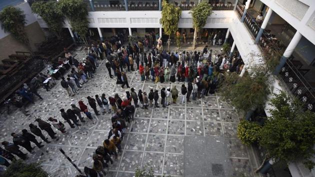 Voters queue at Shaheen Bagh, in Okhla assembly constituency. The Assembly elections come amid ongoing anti-CAA protests across the capital. One of the hotspots of the protest, Shaheen Bagh, has been declared ‘critical’ by Delhi’s Chief Electoral Officer (CEO) Ranbir Singh. All five polling stations in Shaheen Bagh have been declared “critical” . (Burhaan Kinu / HT Photo)