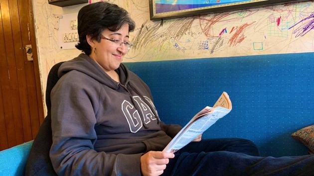 AAP’s Atishi posted pictures of herself reading a book and relaxing at home on Sunday on Twitter.(PHOTO CREDIT: TWITTER.)