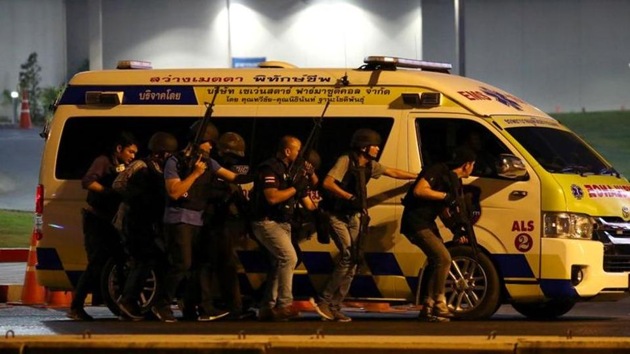 Thailand security forces take cover behind an ambulance as they chase a shooter hidden in a shopping mall after a mass shooting in front of the Terminal 21, in Nakhon Ratchasima, Thailand February 9, 2020. (Reuters image) Thailand security forces take cover behind an ambulance as they chase a shooter hidden in a shopping mall after a mass shooting in front of the Terminal 21, in Nakhon Ratchasima, Thailand February 9, 2020. (Reuters image)