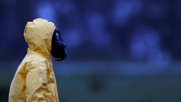A soldier wears a protective suit as Brazilian citizens from China's coronavirus-struck Wuhan, arrive at the Air Force base of Anapolis, State of Goias, Brazil. (REUTERS) A soldier wears a protective suit as Brazilian citizens from China's coronavirus-struck Wuhan, arrive at the Air Force base of Anapolis, State of Goias, Brazil. (REUTERS)