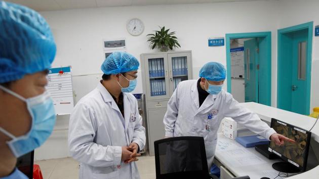 Doctors look at a screen that shows the ward where patients who are infected with the coronavirus are treated at a hospital in Hunan Province. A British citizen living in Mallorca, Spain, has been affected by coronavirus making it Spain’s second case. (REUTERS)