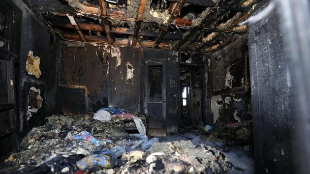 Burned clothes and the interior of a house are destroyed from a fatal fire on Saturday, February 8.(AP Photo) Burned clothes and the interior of a house are destroyed from a fatal fire on Saturday, February 8.(AP Photo)