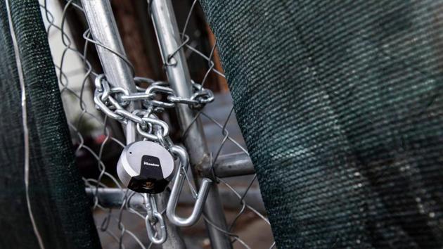 A locked fence blocks the entrance to ‘Moms House’, in Oakland.The group were evicted from the house last month but not before their initiative garnered national attention and prompted officials to vow to do more to address the issue. Walker lived there with her one-year-old son Amir and five-year-old daughter Aja. During the 58 days they and the other moms and kids lived in that house, little Amir took his first steps. (Philip Pacheco / AFP)